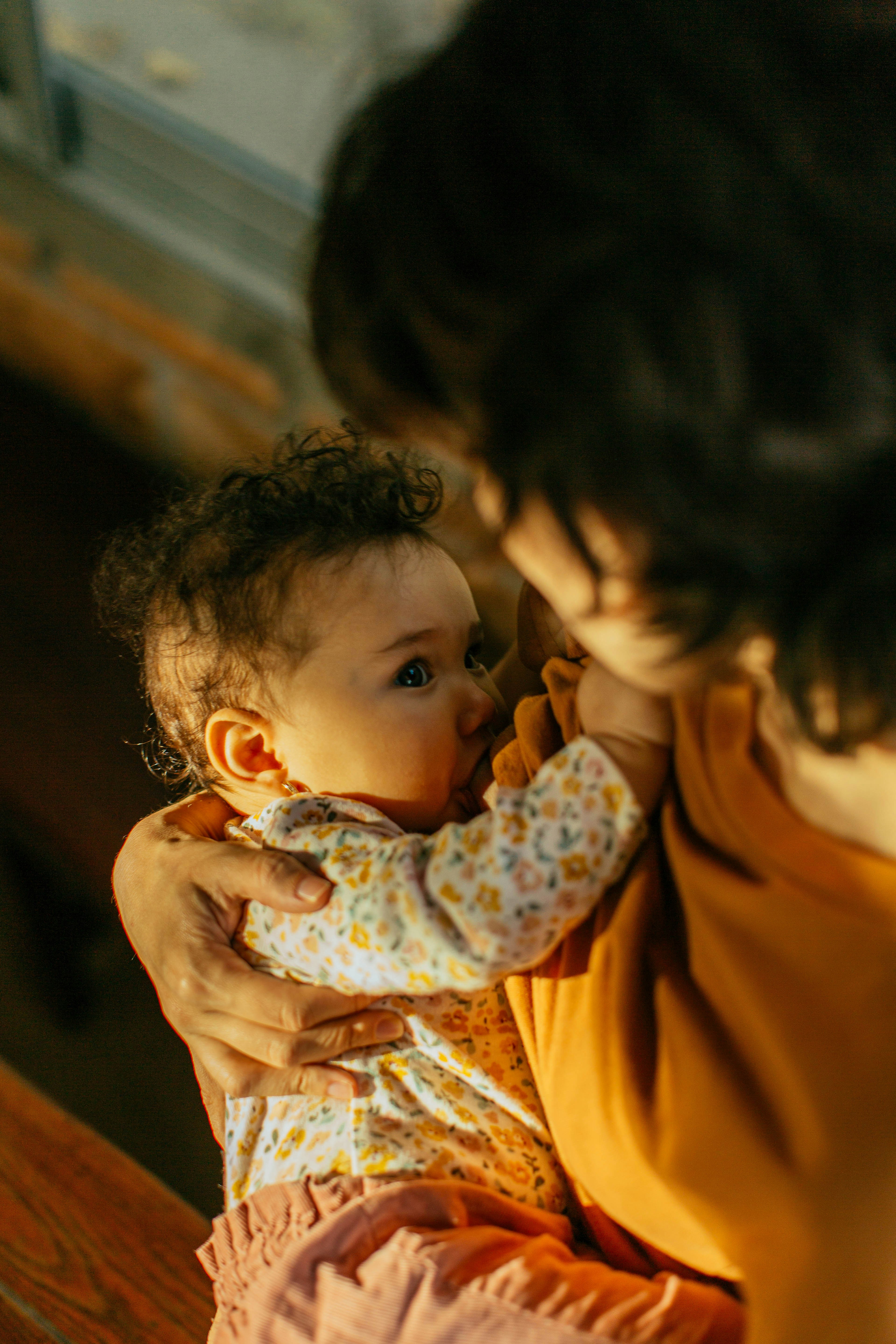 Parent holding a baby.